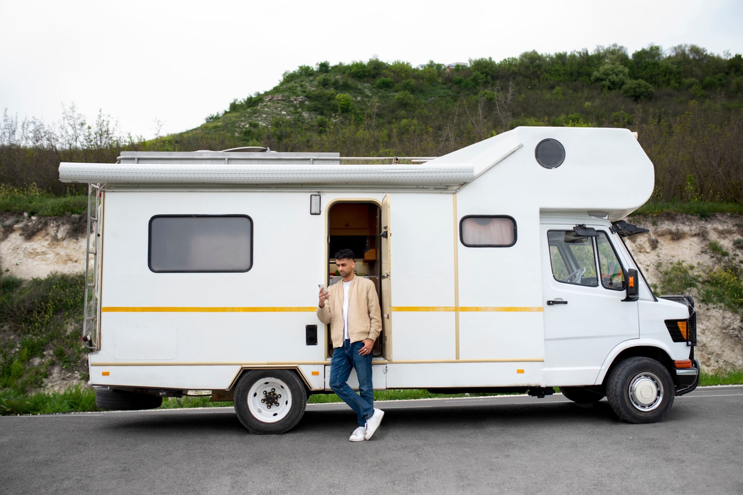 Man standing infront of a mobile home